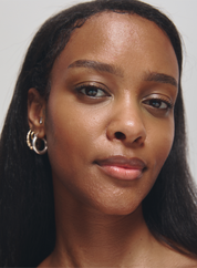 Close-up of a woman with dark skin and long dark hair