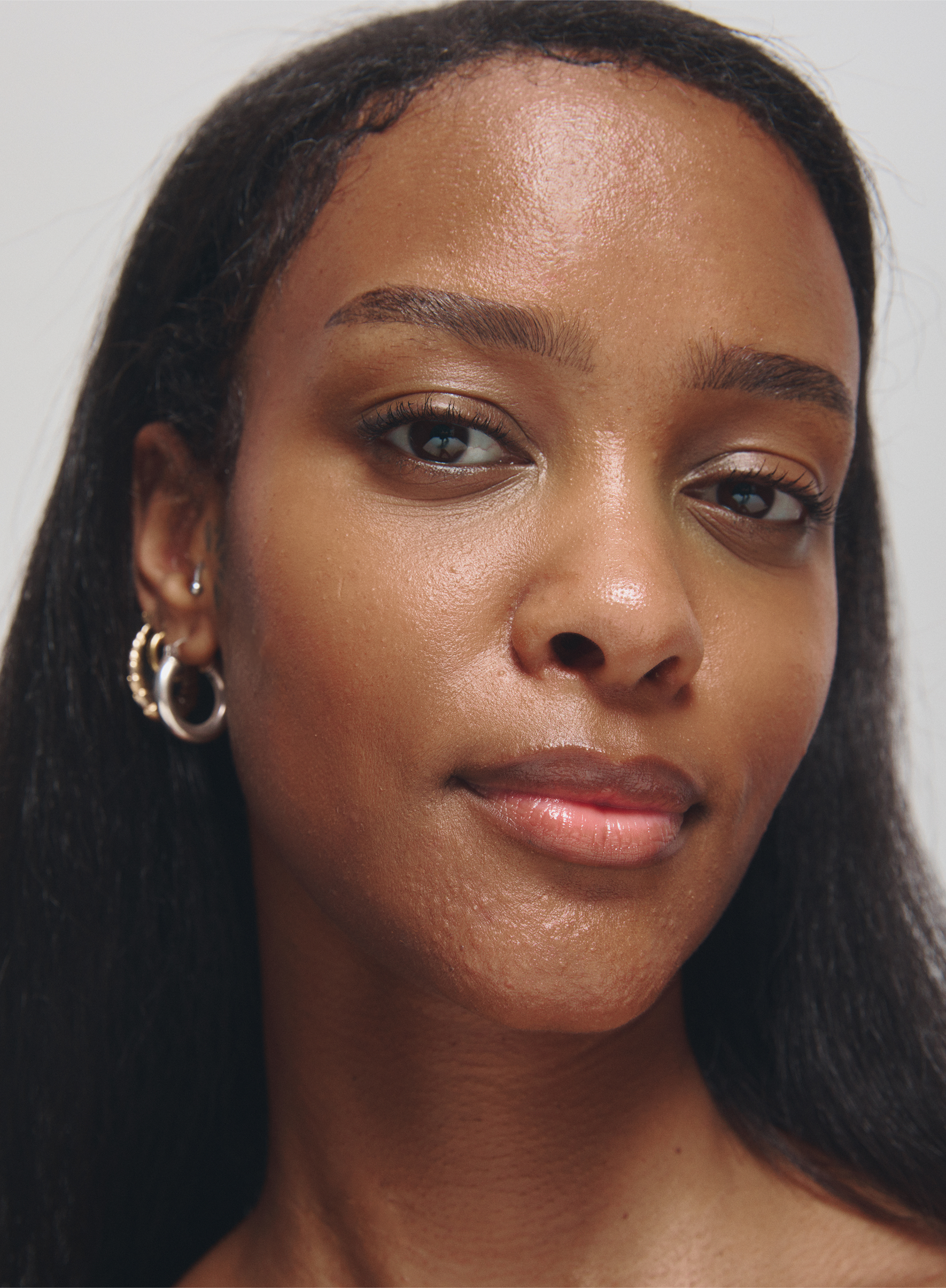 Close-up of a woman with dark skin and long dark hair