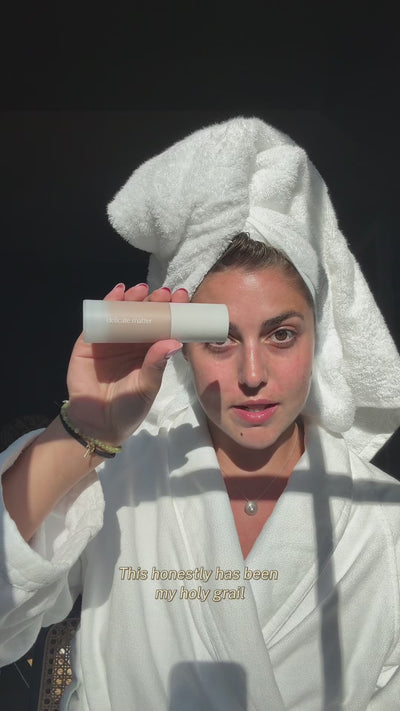 Acne-prone girl applies delicate matter skin tint to cover redness 